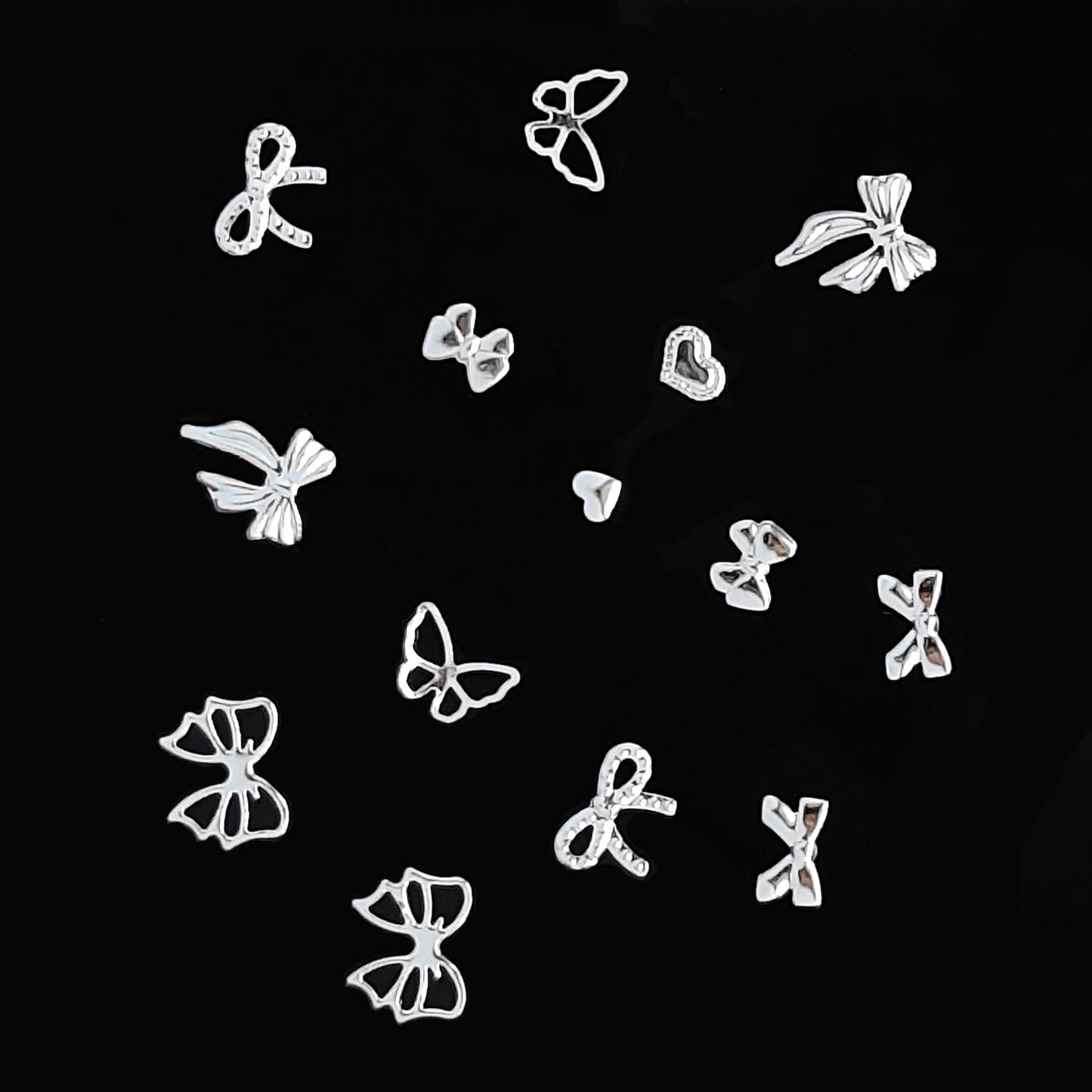 S.A.V.I Silver Alloy Nail Art Charms Set – 7 Designs Bow & Heart Shapes, 8x10mm | 3D Metal Nail Decorations for Women & Girls | Manicure Accessories in Round Storage Box