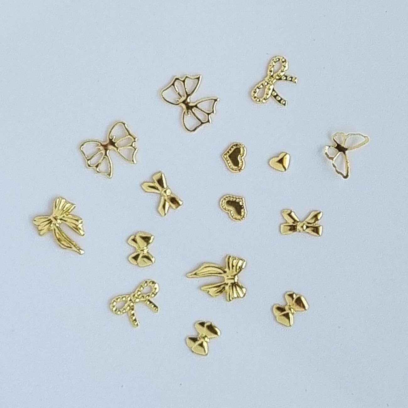 S.A.V.I Gold Alloy 3D Nail Art Charms Set – 7 Designs Bow & Heart Shapes, 8x10mm – Metal Nail Extensions & DIY Manicure Decorations for Women & Girls – 29g
